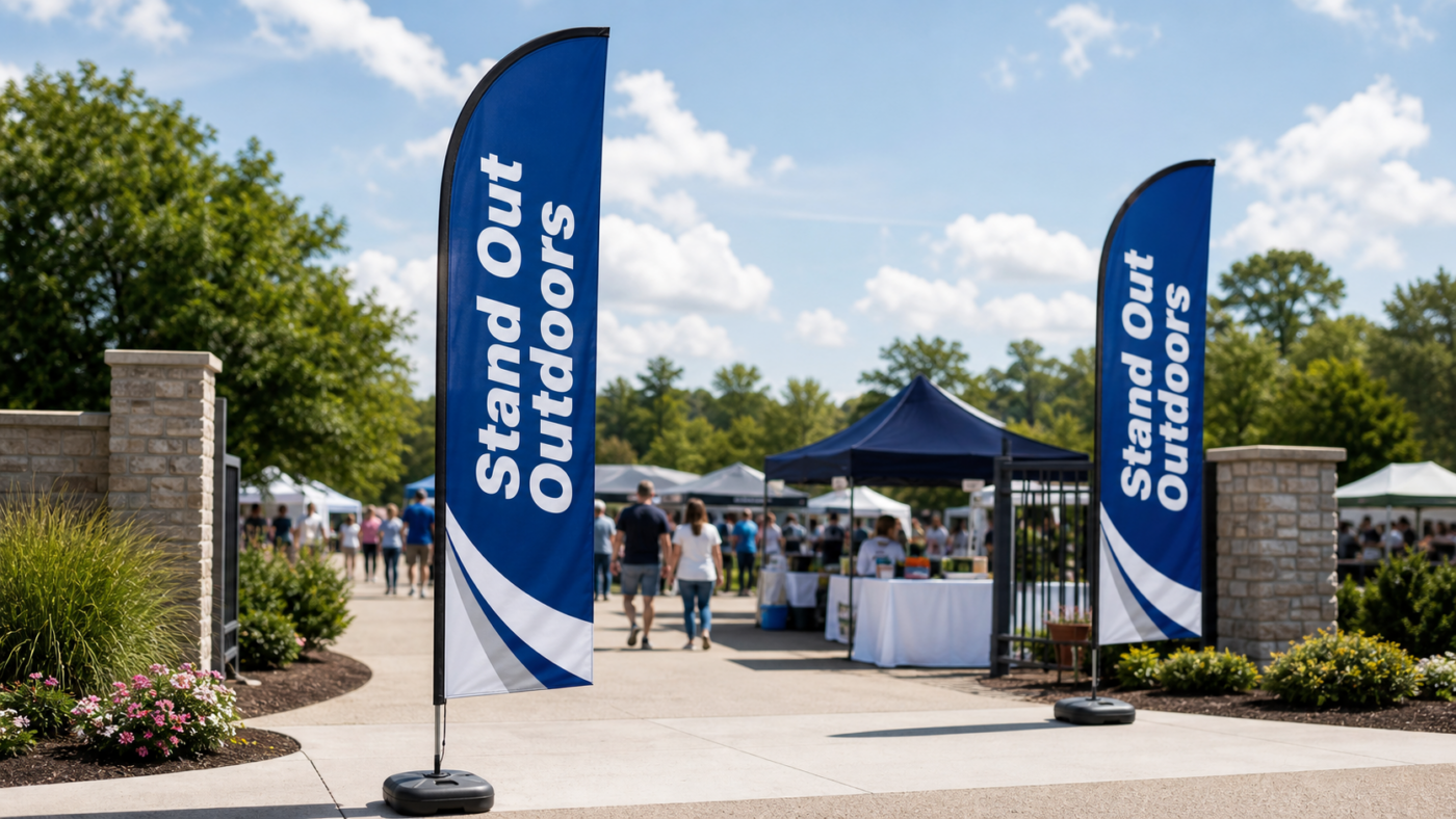 Blade flags displayed at an outdoor event entrance for visible promotional signage.